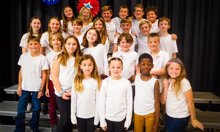 Students sing in Veterans Day performance
